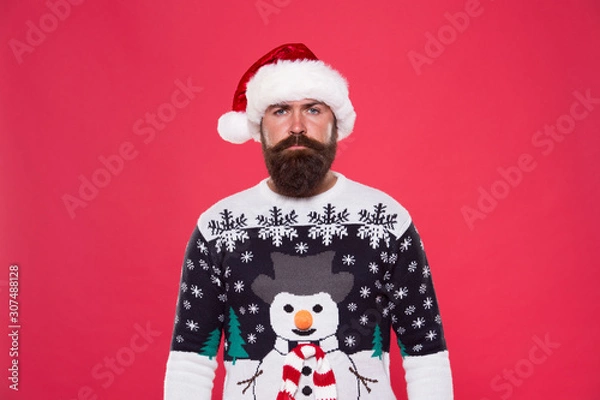 Fototapeta Knitted accessories. Winter weather style. Winter collection. Warmth and comfort. Cold winter conditions. Handsome bearded man wear jumper with snowman pattern red background. Winter sweater