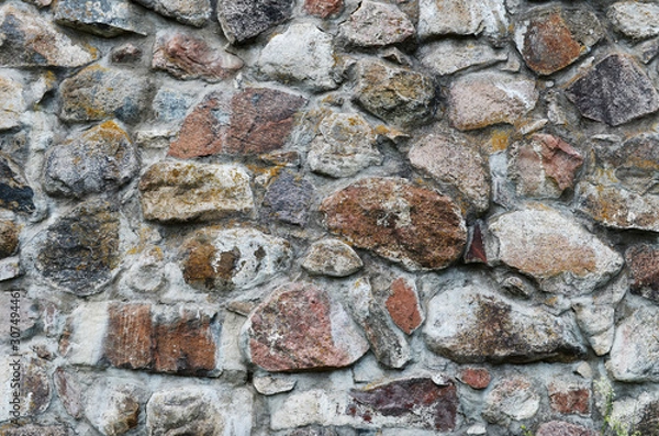Fototapeta Stone wall background. Texture of old masonry. Monochrome background.