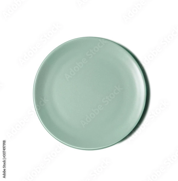 Fototapeta New luxury cutlery view from above on a isolated white background. Top view. Porcelain green saucer. Trendy plate pastel shades. Flat lay view.