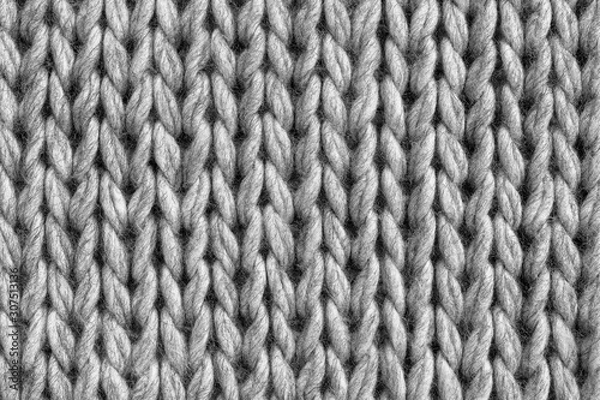 Fototapeta Gray knitted woolen sweater texture. Flat lay, top view, close-up