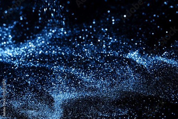 Fototapeta Splash of blue sparkles on black background. Color of the year 2020 concept.