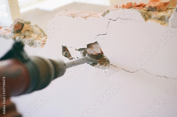 Obraz Professional worker in construction site using jackhammer