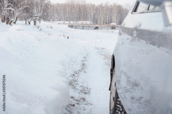 Fototapeta Car on a winter road. Snowy road.