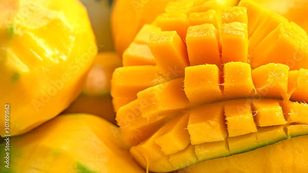 Obraz close up Mango fruit and mango cubes macro photography texture background