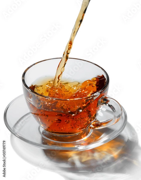 Fototapeta Tea flowing in cup