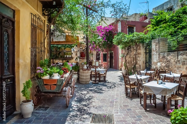Fototapeta Courtyard of the tavern in the port of Chania