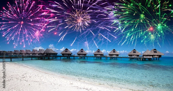Obraz Festive New Year's fireworks over the tropical island, mixed media