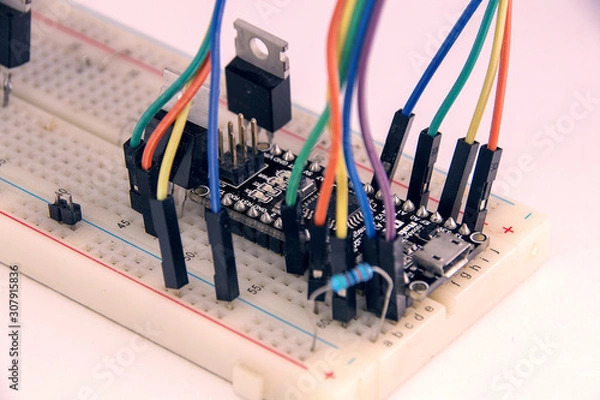 Fototapeta circuit Board with radio parts and colored wires.