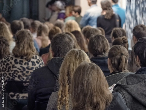 Fototapeta People sitting back in the conference room.