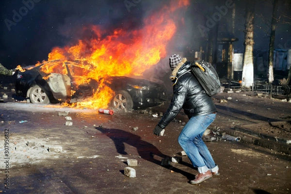 Fototapeta Fights between rebels and police