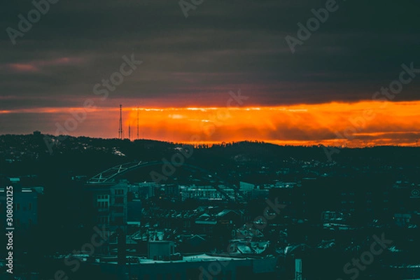 Obraz Sun peeking through clouds