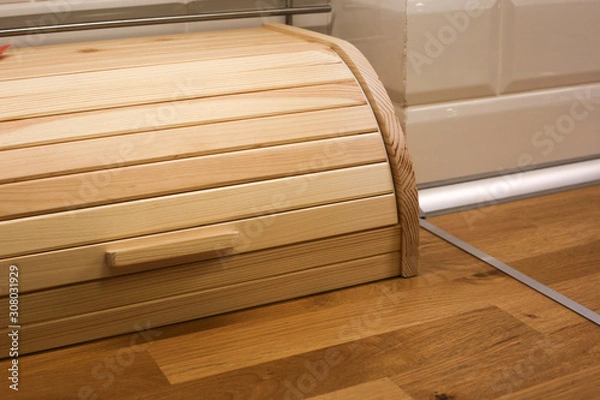 Obraz Wooden breadbasket at the kitchen. Box for keeping bread.