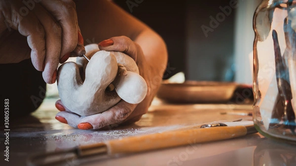 Fototapeta creating sculpture in shady art studio