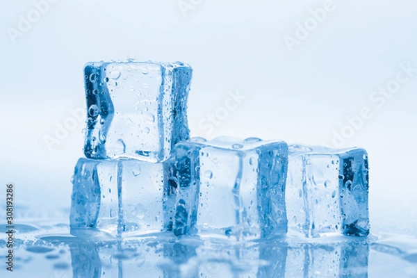 Fototapeta Ice cubes square with drops water clean on blue background