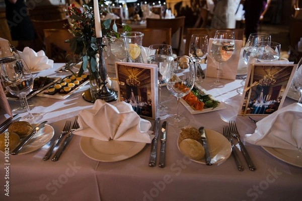 Fototapeta Food served on table in a white hall during a Birthday corporate party in Eastern European Baltic Riga, Latvia - creme and biege colors - Canape, snacks and light drinks