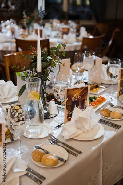 Fototapeta Food served on table in a white hall during a Birthday corporate party in Eastern European Baltic Riga, Latvia - creme and biege colors - Canape, snacks and light drinks