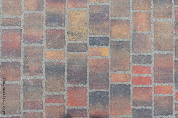 Fototapeta Paving texture with bricks of different colors