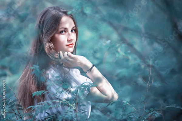 Fototapeta A girl in a spring green park