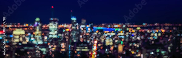 Fototapeta Abstract urban night light bokeh defocused background.