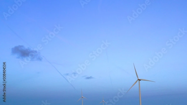 Fototapeta Wind turbine from aerial view - Sustainable development, environment friendly, renewable energy concept. Aerial View Of Wind Turbines In Blue Sky.