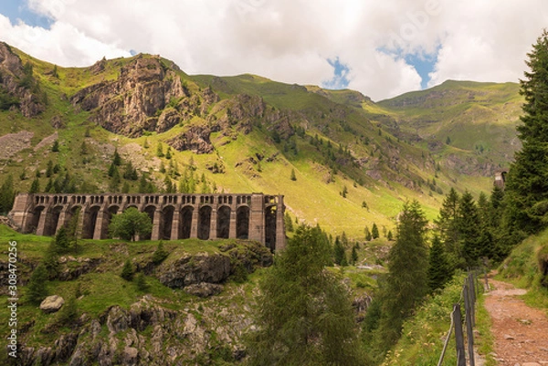 Fototapeta Morning view of the Gleno dam from the path that arrives in the Val di Scalve