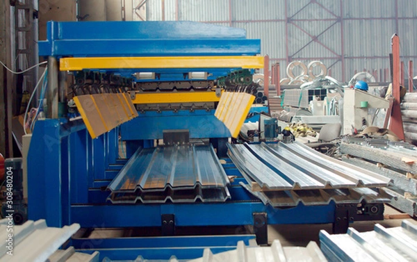 Fototapeta Bending machine for corrugated metal sheets in the production plant