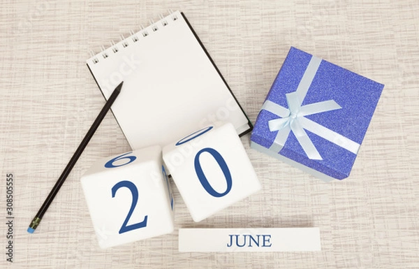 Fototapeta Calendar with trendy blue text and numbers for June 20 and a gift in a box.