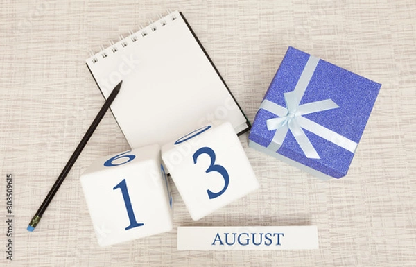 Fototapeta Calendar with trendy blue text and numbers for August 13 and a gift in a box.