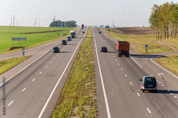 Fototapeta Aerial view of the expressway through the countryside. Beautiful sunny day