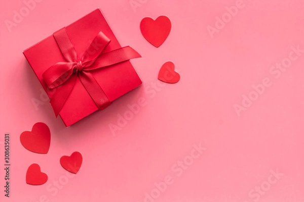 Obraz Gift to a sweetheart on Valentine's Day. Red present box near hearts on pink background top-down copy space
