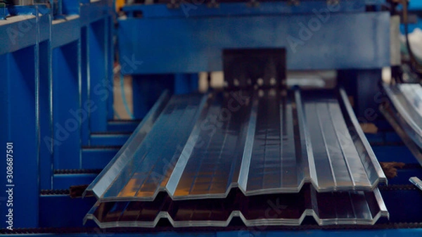 Fototapeta Bending machine for corrugated metal sheets in the production plant
