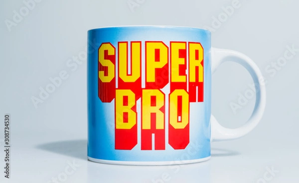 Obraz London, England, 24/10/2019 Super Bro mega mug on isolated white background lit professional in studio. Type in text font like mario or other retro games even superman comic book style