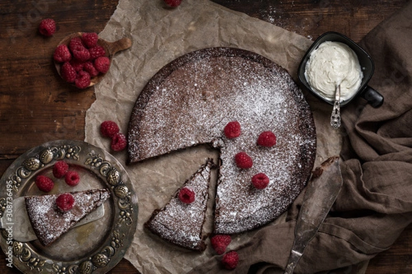 Obraz Chocolate mud cake kladdkaka or sticky chocolate cake with raspberries