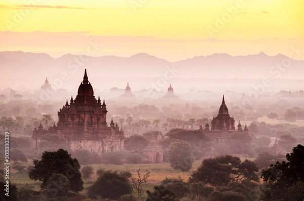 Fototapeta The pagoda landscape with beautiful fog in the morning in Myanmar