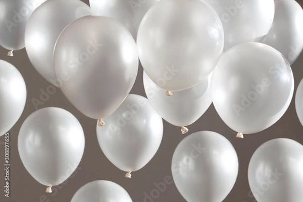 Obraz white balloons flying on beige background