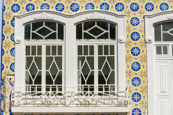 Fototapeta facade covered with azulejos on an old house in Olhao, Algarve, Portugal