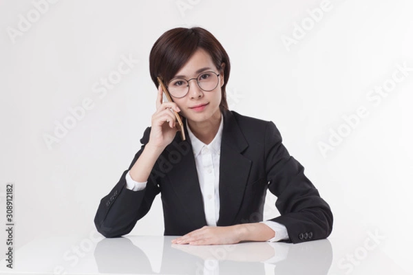 Obraz Young Asian short hair female model in formal dress which is good for business purpose