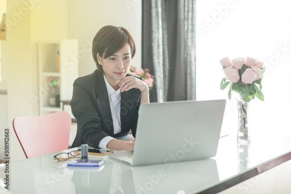 Obraz Young Asian short hair female model in formal dress which is good for business purpose