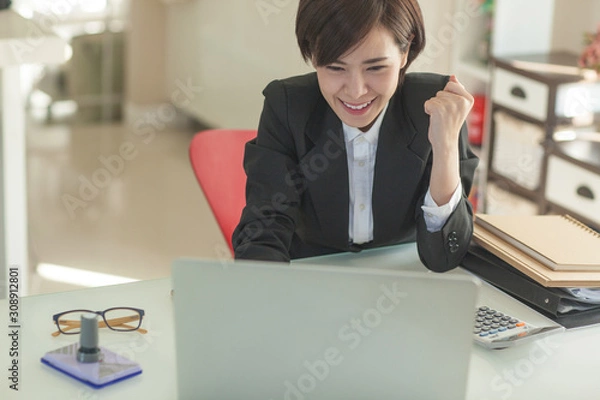 Obraz Young Asian short hair female model in formal dress which is good for business purpose