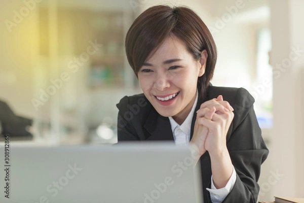 Obraz Young Asian short hair female model in formal dress which is good for business purpose