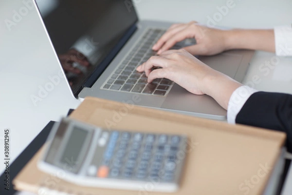 Obraz beautiful hands on a laptop keyboard