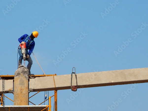 Obraz Man Working on the Working at height in construction site