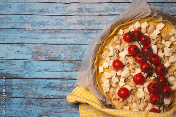 Fototapeta tasty colorful homemade pie with feta chicken and cherry tomatoes isolated