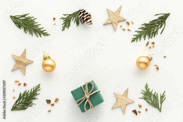 Fototapeta Christmas composition. Gift star bauble top view background with copy space for your text. Flat lay.