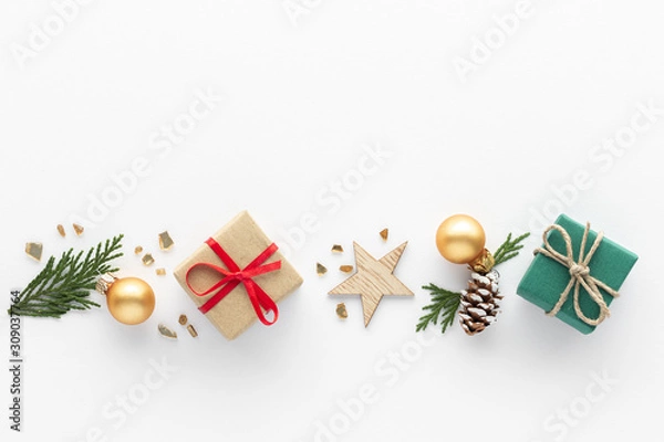 Fototapeta Christmas composition. Gift star bauble top view background with copy space for your text. Flat lay.