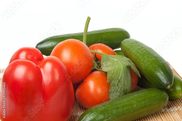 Fototapeta Ripe vegetables on a straw mat