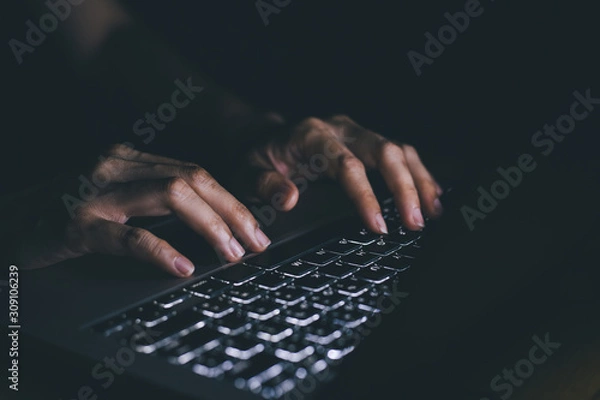 Obraz using computer.hand typing message on keyboard laptop chatting friend and search information form internet