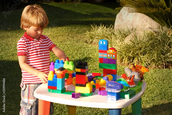 Fototapeta Boy playing with blocks