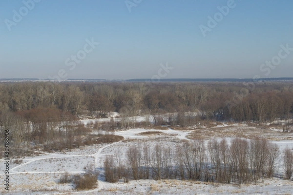 Fototapeta Winter landscape in forest and fields