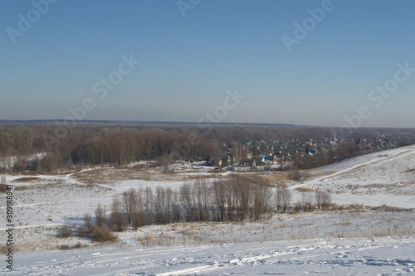 Fototapeta Winter landscape in forest and fields